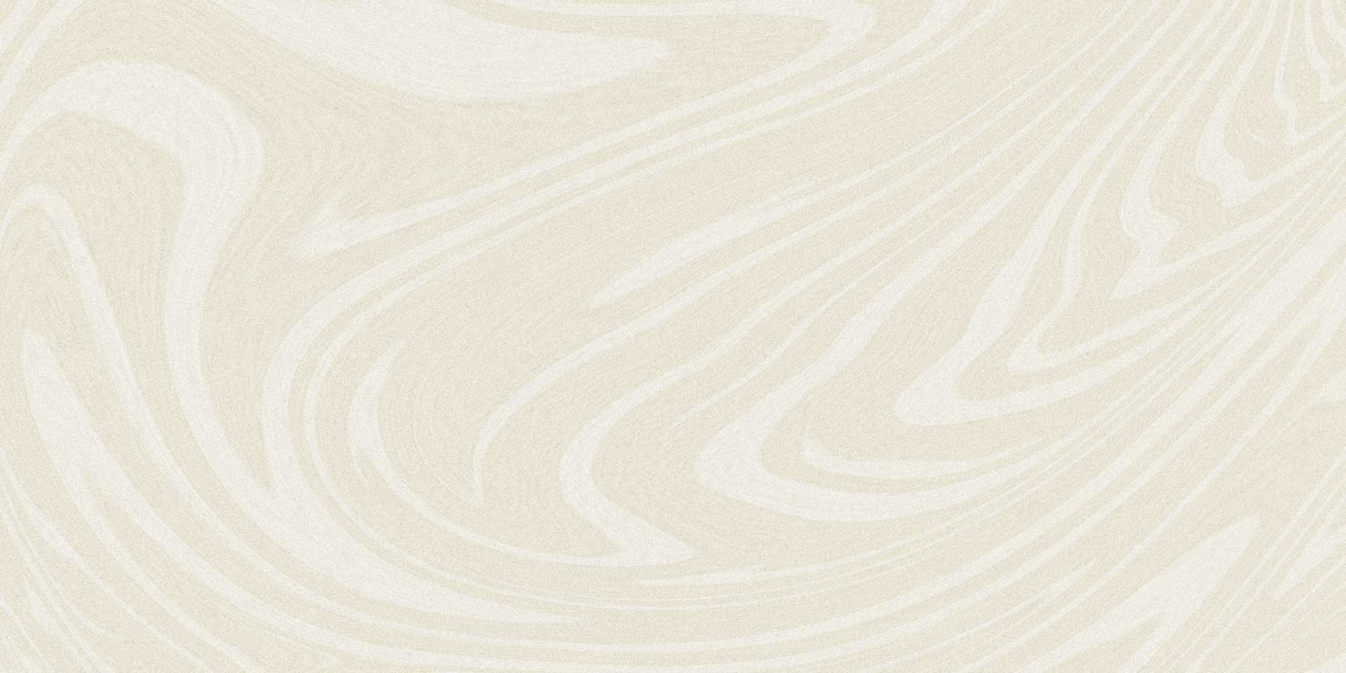 A close up textured surface showing a subtle off white granular