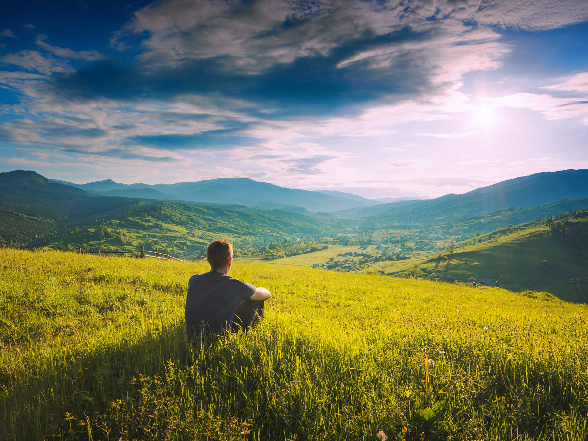 Tourist sitting on a hill